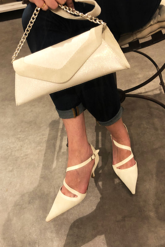 Off white women's open side shoes, with snake-shaped straps. Pointed toe. High slim heel. Worn view - Florence KOOIJMAN